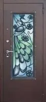 Декоративная отделка из художественной ковки на входной двери (72)